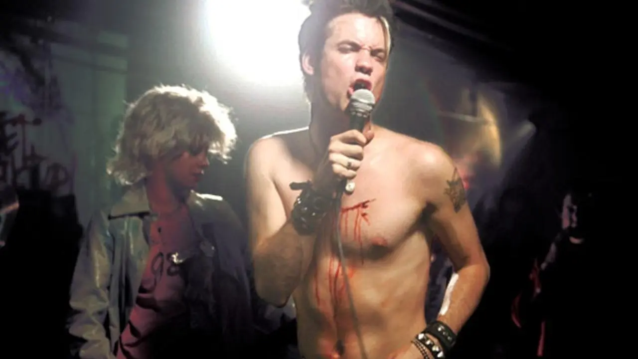 What We Do Is Secret backdrop